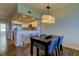 Charming dining area adjacent to the kitchen, highlighted by a stylish pendant light and breakfast bar at 129 Brent Cir, Oldsmar, FL 34677