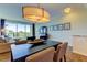 Bright dining area with a view, seamlessly connected to the living room and a spacious balcony at 129 Brent Cir, Oldsmar, FL 34677