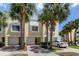 Charming townhome with a two-car garage, lush landscaping and brick-paved driveway at 129 Brent Cir, Oldsmar, FL 34677
