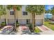Charming townhouse with garages, lush landscaping, and a private entrance near the bay at 129 Brent Cir, Oldsmar, FL 34677