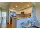 Modern kitchen featuring stainless steel appliances, breakfast bar, and stylish backsplash at 129 Brent Cir, Oldsmar, FL 34677