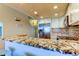 Well-appointed kitchen with stainless steel appliances, granite countertops, and a convenient breakfast bar at 129 Brent Cir, Oldsmar, FL 34677