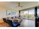 Living room showcasing an open layout, modern furnishings and a balcony with beautiful outdoor views at 129 Brent Cir, Oldsmar, FL 34677