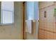 Clean bathroom with a shower/tub combo, updated vanity, and a window at 402 Blue Marlin Dr, Oldsmar, FL 34677