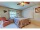 Cozy bedroom with a double bed and plenty of natural light at 402 Blue Marlin Dr, Oldsmar, FL 34677