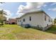 Rear view of house, showcasing yard and neighbor's home at 402 Blue Marlin Dr, Oldsmar, FL 34677