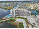 Aerial view showcasing the waterfront condo complex, featuring a tennis court, beach, and stunning views at 6035 Sea Ranch Dr # 505, Hudson, FL 34667