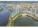 Aerial view of a large waterfront condo community and swimming pool on the water at 6035 Sea Ranch Dr # 505, Hudson, FL 34667