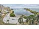 Beautiful community aerial view showcasing beach, bay, pool, landscaping, and beachfront condos at 6035 Sea Ranch Dr # 505, Hudson, FL 34667