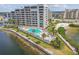 Waterfront condo complex has beautiful views, a pool, and a seating area on the shore at 6035 Sea Ranch Dr # 505, Hudson, FL 34667