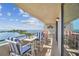 Enjoy serene waterfront views from this condo's balcony, complete with dining set and comfortable seating at 6035 Sea Ranch Dr # 505, Hudson, FL 34667