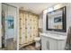 Bathroom features a toilet, sink, and shower with patterned curtain at 6035 Sea Ranch Dr # 505, Hudson, FL 34667