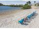 Stunning beach view with lounge chairs; perfect for relaxing by the water and enjoying the waterfront lifestyle at 6035 Sea Ranch Dr # 505, Hudson, FL 34667