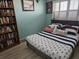 Nautical-themed bedroom with blue accents, comfortable bedding and a book case at 6035 Sea Ranch Dr # 505, Hudson, FL 34667