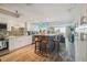 Bright and airy kitchen featuring ample cabinet space, a breakfast bar with stools, and open floor plan at 6035 Sea Ranch Dr # 505, Hudson, FL 34667