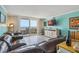 Bright living room with ocean views from sliding glass doors to the outdoor balcony at 6035 Sea Ranch Dr # 505, Hudson, FL 34667