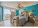 Cozy main bedroom with water view access to the outdoor balcony and natural light at 6035 Sea Ranch Dr # 505, Hudson, FL 34667