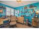 Office space featuring lots of decor, a large desk, and a blue accent wall at 6035 Sea Ranch Dr # 505, Hudson, FL 34667