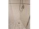 Close up of the shower with neutral tile walls and stone tile flooring at 6035 Sea Ranch Dr # 505, Hudson, FL 34667