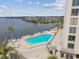 Relaxing pool area with lounge chairs and beautiful views of the waterfront and neighborhood at 6035 Sea Ranch Dr # 505, Hudson, FL 34667