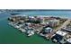 Stunning aerial view of waterfront condos, boat marina and beautiful blue ocean and intercoastal waterway at 830 S Gulfview Blvd # 305, Clearwater Beach, FL 33767
