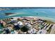 Beautiful aerial view of waterfront condos, tennis courts, and sandy beaches at 830 S Gulfview Blvd # 305, Clearwater Beach, FL 33767
