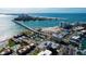 Breathtaking aerial of bayfront condos, white sand beach, and bridge overlooking amazing views at 830 S Gulfview Blvd # 305, Clearwater Beach, FL 33767