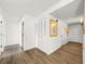 Hallway featuring white louvered closet doors and wood-look flooring at 830 S Gulfview Blvd # 305, Clearwater Beach, FL 33767