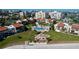 Aerial view of condos overlooking pool, outdoor seating, and well-manicured lawn at 830 S Gulfview Blvd # 305, Clearwater Beach, FL 33767