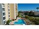 Relaxing outdoor pool and deck area next to bayfront condo building at 830 S Gulfview Blvd # 305, Clearwater Beach, FL 33767