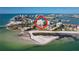 Aerial view highlighting a waterfront building in a coastal community at 830 S Gulfview Blvd # 305, Clearwater Beach, FL 33767