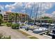 Condominium building and marina with docked boats at 1750 Harbor S Pl # 103, South Pasadena, FL 33707
