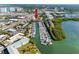 Aerial view of waterfront property with boat slips and nearby buildings at 1750 Harbor S Pl # 103, South Pasadena, FL 33707