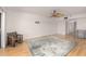 Spacious living room with hardwood floors and ceiling fan at 1750 Harbor S Pl # 103, South Pasadena, FL 33707