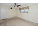 Bright bedroom with ceiling fan and window at 1750 Harbor S Pl # 103, South Pasadena, FL 33707