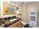 Bathroom with granite countertop and updated vanity at 1750 Harbor S Pl # 103, South Pasadena, FL 33707