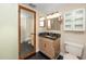 Bathroom with granite countertop and double vanity at 1750 Harbor S Pl # 103, South Pasadena, FL 33707