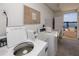 Well-lit laundry room with coin-operated washer and dryer at 1750 Harbor S Pl # 103, South Pasadena, FL 33707