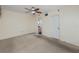 Spacious bedroom with ceiling fan and carpet at 1750 Harbor S Pl # 103, South Pasadena, FL 33707