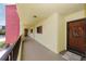 Condo hallway with access to unit, featuring nautical-themed door at 1750 Harbor S Pl # 103, South Pasadena, FL 33707