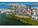 Aerial view highlighting condo building near marina and city at 1750 Harbor S Pl # 103, South Pasadena, FL 33707