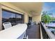 Spacious balcony with table, chairs, and a grill at 1750 Harbor S Pl # 103, South Pasadena, FL 33707
