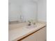 Simple bathroom with a single sink vanity and mirror at 1750 Harbor S Pl # 103, South Pasadena, FL 33707