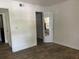 Spacious bedroom with mirrored closet doors and wood-look tile floors at 10200 Gandy N Blvd # 816, St Petersburg, FL 33702