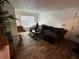 Living room with sectional sofa, coffee table, and tile floors at 10200 Gandy N Blvd # 816, St Petersburg, FL 33702