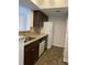 Kitchen with granite countertops, dark cabinets and appliances at 10200 Gandy N Blvd # 816, St Petersburg, FL 33702