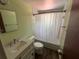 Clean bathroom with white vanity and tub shower combo at 5060 86Th Ave N, Pinellas Park, FL 33782