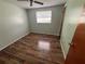 Charming bedroom with wood-look floors and ceiling fan at 5060 86Th Ave N, Pinellas Park, FL 33782