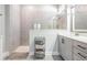 Contemporary bathroom featuring a walk-in shower, gray vanity, and neutral color scheme at 16701 Vibrato Ln, Land O Lakes, FL 34638