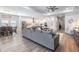 Bright, open living area seamlessly connects the living, dining, and kitchen spaces for easy entertaining at 16701 Vibrato Ln, Land O Lakes, FL 34638